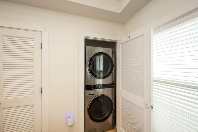 5960 Peninsular Ave Unit 108, Stock Island, FL 33040 - laundry area with stacked washer / drying machine and plenty of natural light