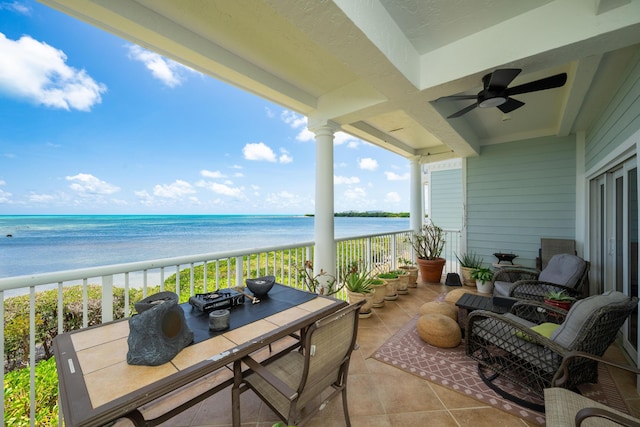 5960 Peninsular Ave Unit 108, Stock Island, FL 33040 - balcony with view of water and beach, a ceiling fan, and outdoor dining area