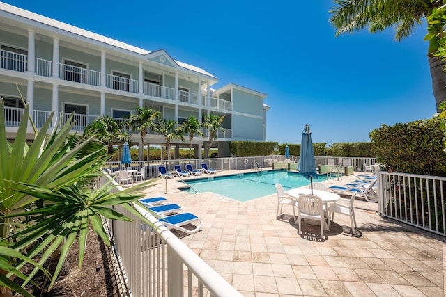 5960 Peninsular Ave Unit 108, Stock Island, FL 33040 - community pool featuring fence and a patio