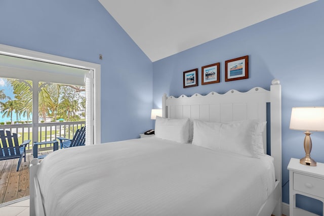 bedroom featuring access to outside and vaulted ceiling