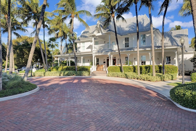 view of front of house featuring a balcony