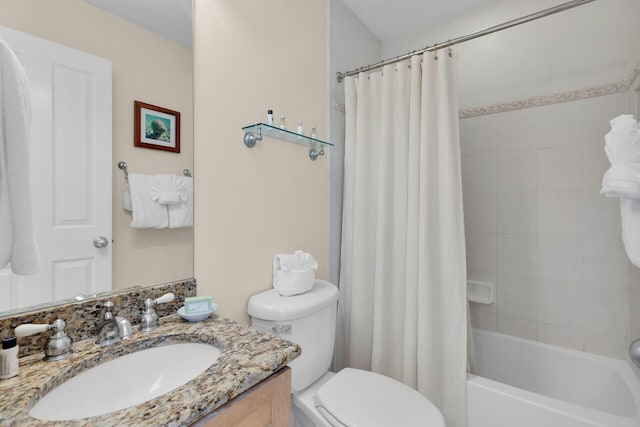 full bathroom featuring shower / tub combo with curtain, vanity, and toilet