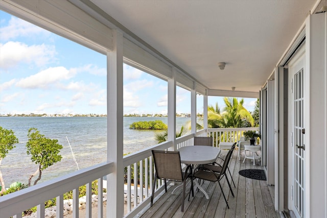 wooden deck featuring a water view