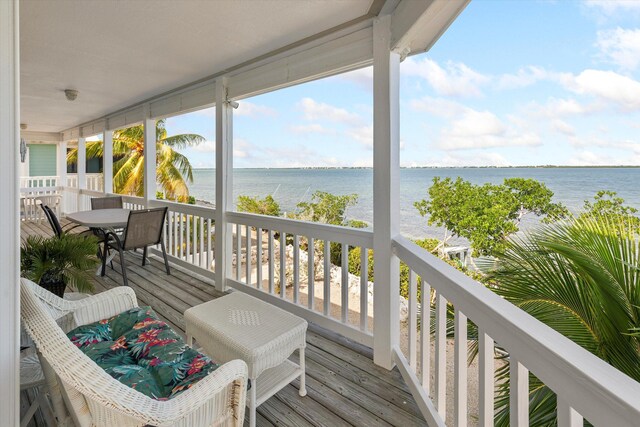 deck featuring a water view