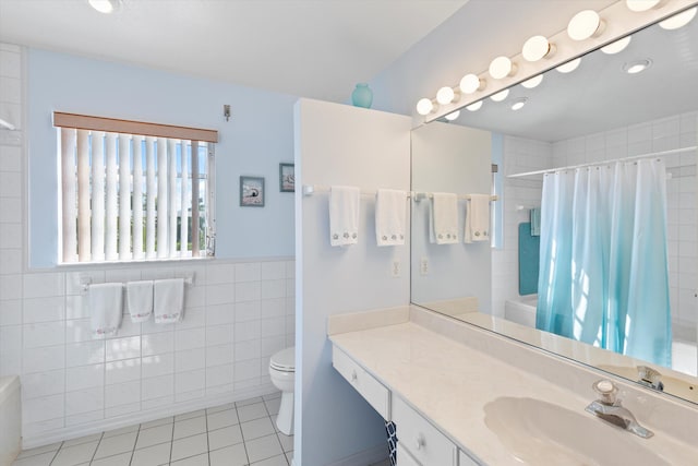 full bathroom with toilet, tile walls, vanity, shower / bath combo, and tile patterned flooring