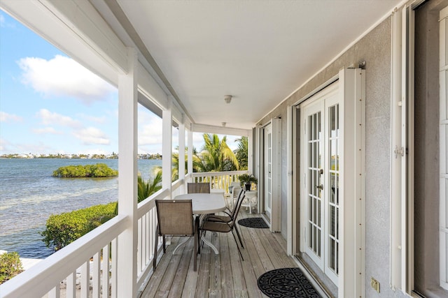 exterior space featuring a water view and french doors