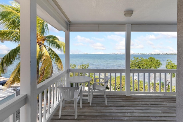 wooden deck with a water view