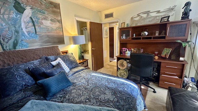 carpeted bedroom with a textured ceiling