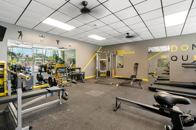 workout area featuring a paneled ceiling