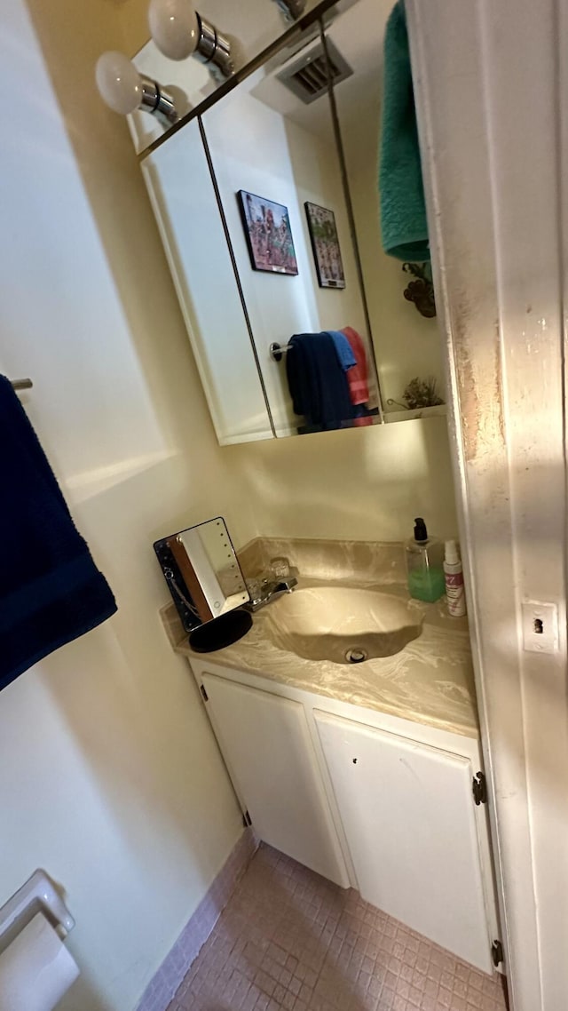 bathroom featuring vanity and tile patterned flooring