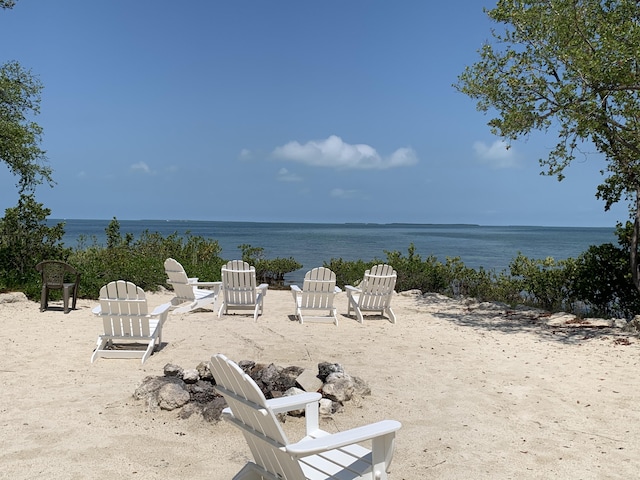 property view of water featuring a beach view