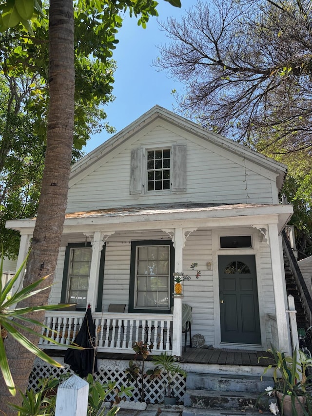 1428 Virginia St, Key West, FL 33040 - shotgun-style home featuring a porch