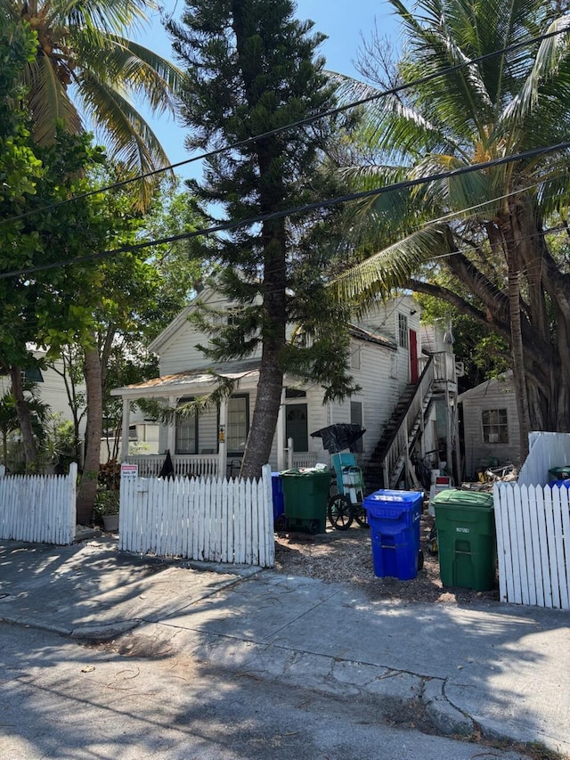 1428 Virginia St, Key West, FL 33040 - view of front of house featuring a fenced front yard and a porch