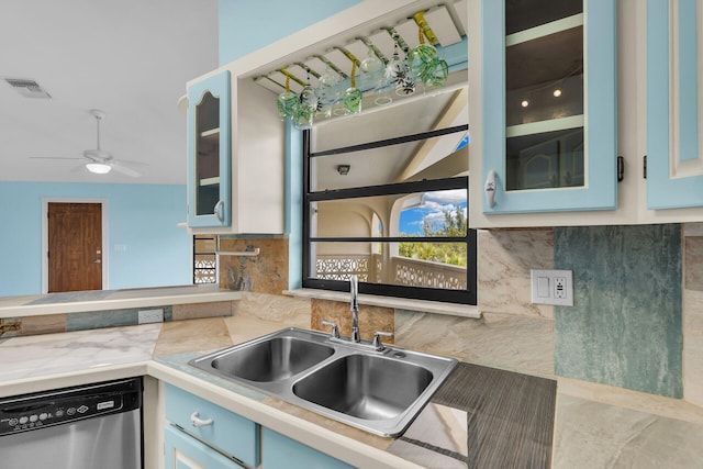 3667 S Seas St, Big Pine, FL 33043 - kitchen featuring stainless steel dishwasher, a sink, light countertops, ceiling fan, and glass insert cabinets
