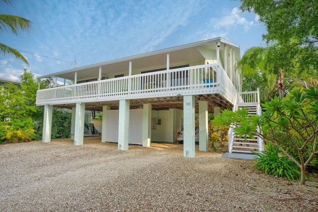 back of property featuring a carport