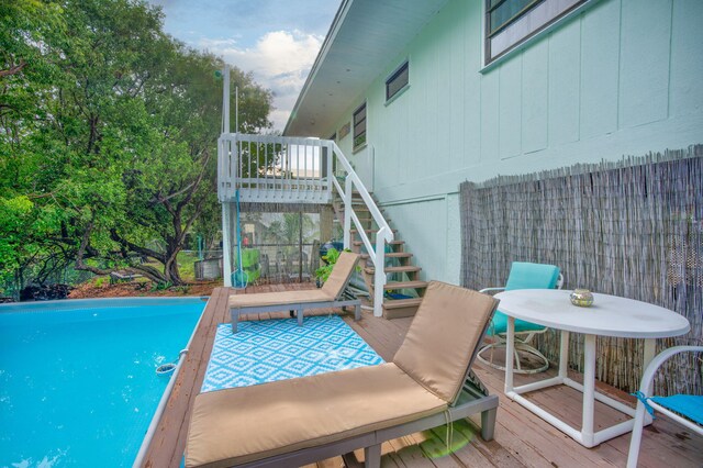 view of pool with a deck