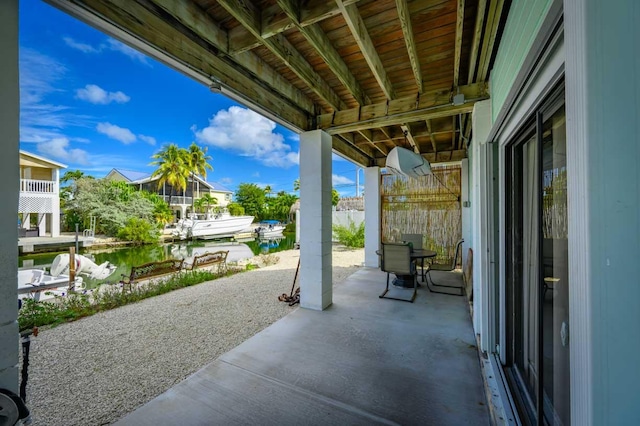 view of patio featuring a water view