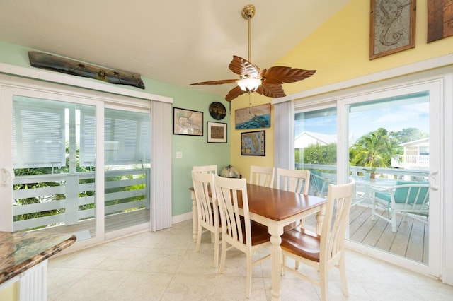 dining area with ceiling fan and light tile patterned flooring