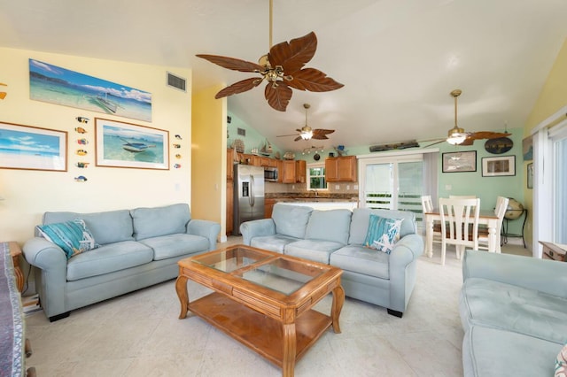 living room featuring high vaulted ceiling, light tile patterned floors, and ceiling fan