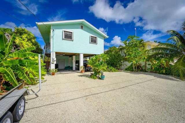 rear view of property featuring a carport