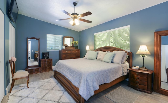 bedroom featuring ceiling fan and light wood-type flooring