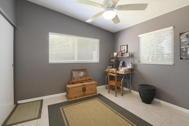 office space featuring ceiling fan and light tile patterned floors