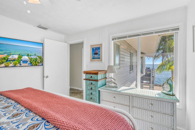 bedroom featuring visible vents, baseboards, and access to outside