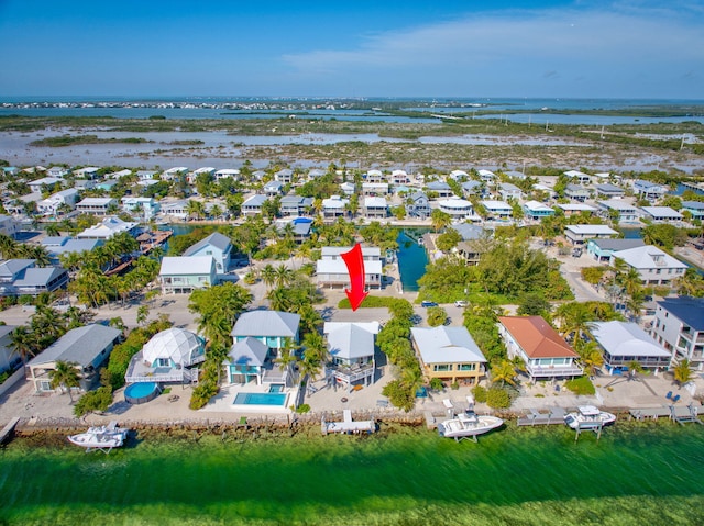 aerial view with a residential view and a water view