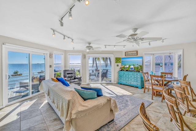 living room featuring track lighting and a ceiling fan