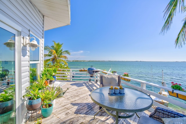 view of patio / terrace featuring a deck with water view