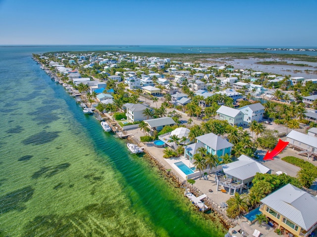 bird's eye view with a residential view and a water view