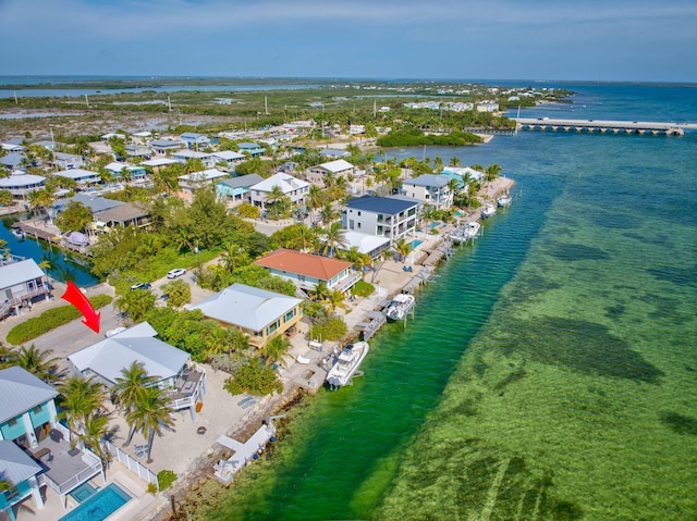 bird's eye view featuring a water view and a residential view