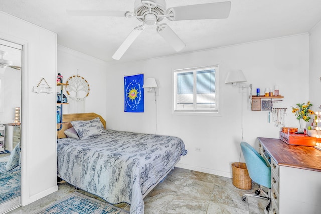 bedroom with baseboards and a ceiling fan