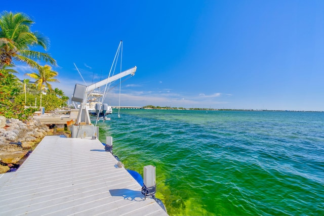 dock area featuring a water view and boat lift