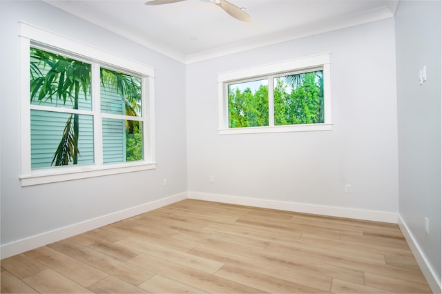 spare room featuring ceiling fan, ornamental molding, and light hardwood / wood-style floors