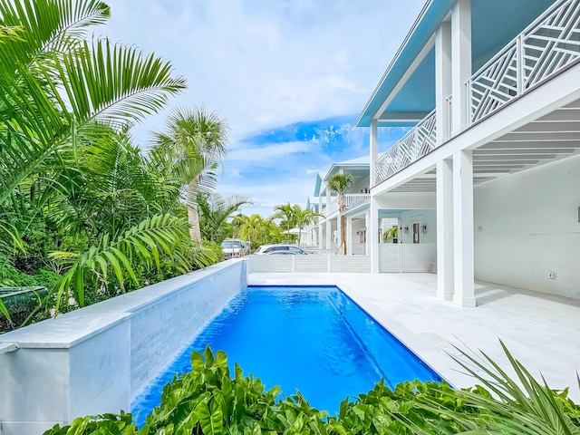 view of swimming pool with a patio area