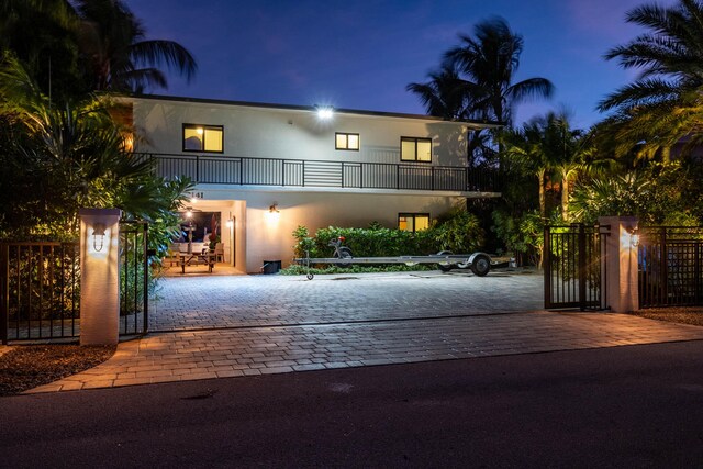 view of front of property with a balcony