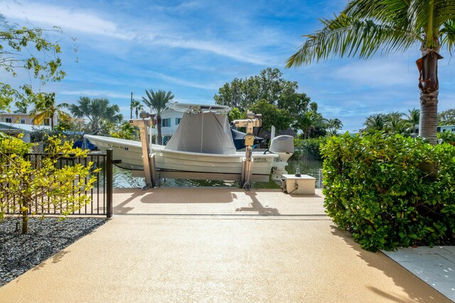 view of gate with a water view