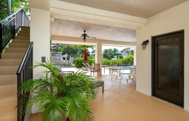 view of patio featuring ceiling fan