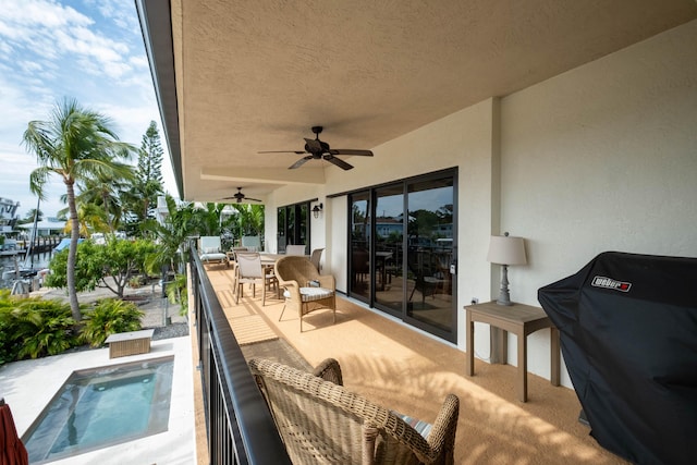 view of patio / terrace featuring ceiling fan, grilling area, an outdoor hangout area, and a balcony