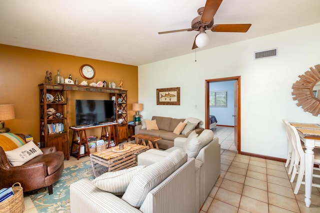 tiled living room with ceiling fan