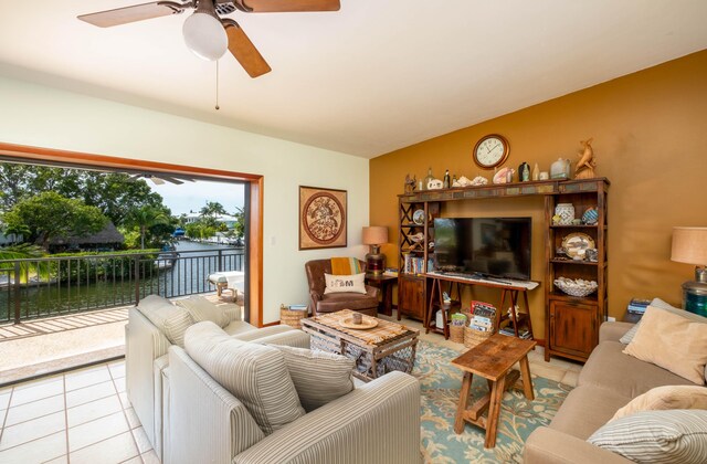 tiled living room with ceiling fan