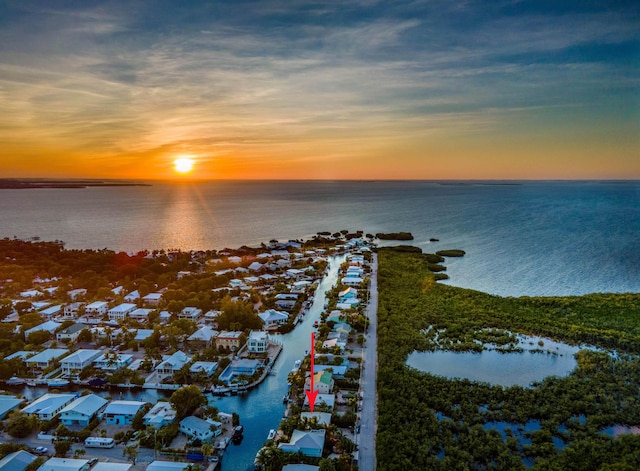 aerial view at dusk with a water view