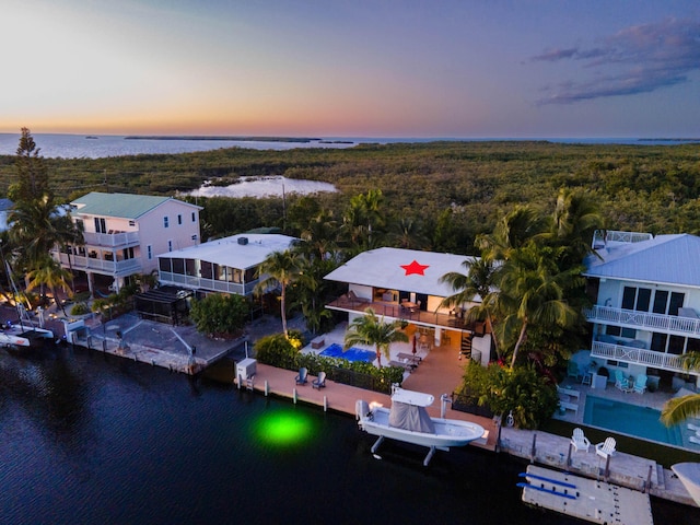 aerial view at dusk with a water view