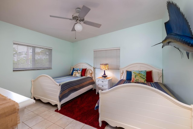 bedroom featuring ceiling fan and light tile patterned floors