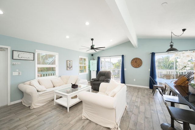 living room featuring vaulted ceiling with beams, ceiling fan, and light hardwood / wood-style flooring