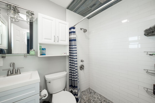 bathroom featuring vanity, toilet, and a shower with shower curtain