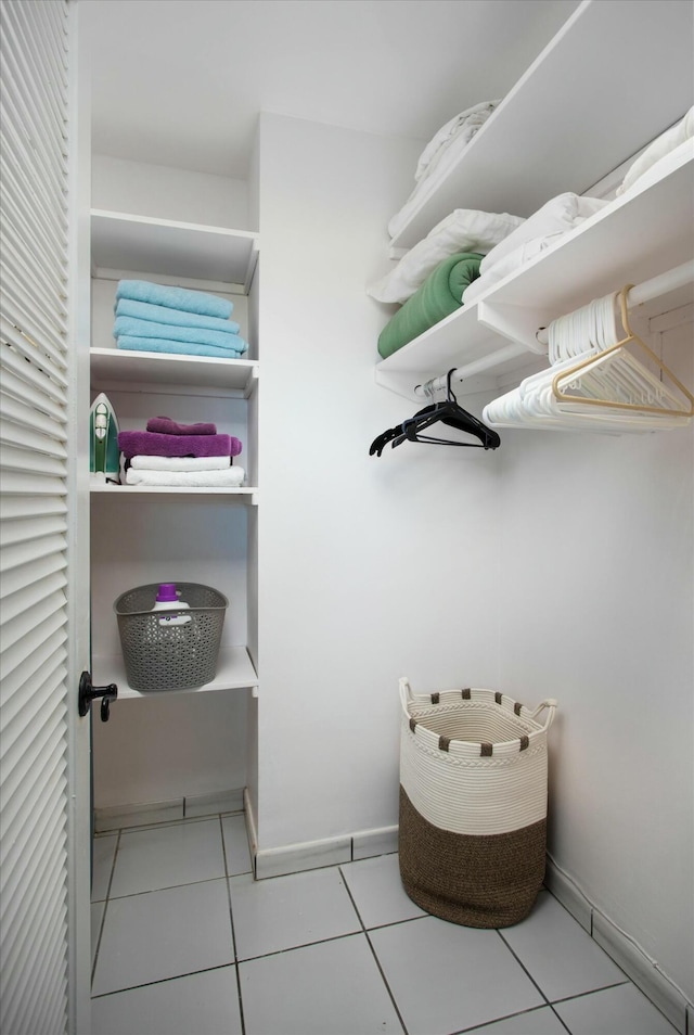 spacious closet with light tile patterned flooring