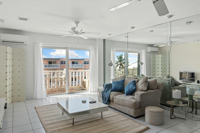 living room with ceiling fan, light tile patterned floors, and an AC wall unit