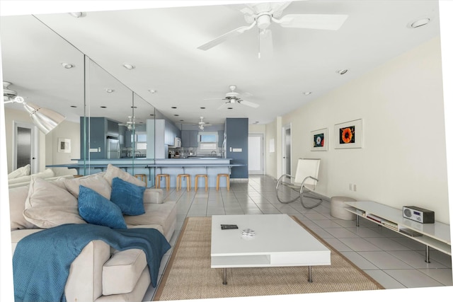 tiled living room featuring ceiling fan